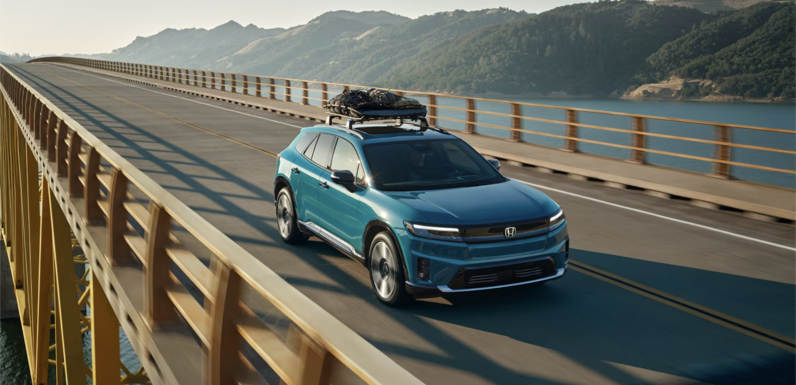 A blue Honda EV driving