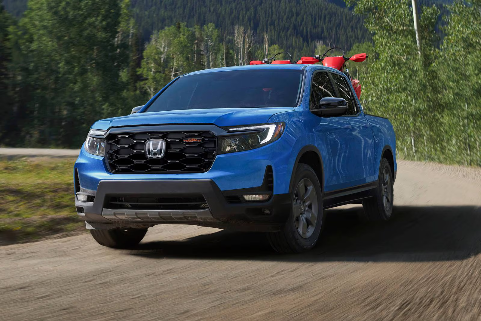 Honda Ridgeline hauling ATVs