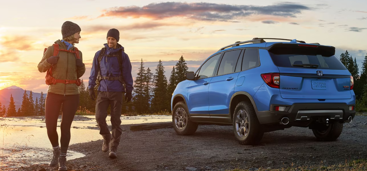 A used Honda SUV parked near a lake