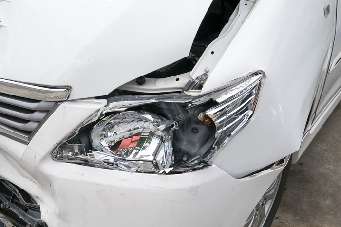 Damaged front headlight needing Honda repair