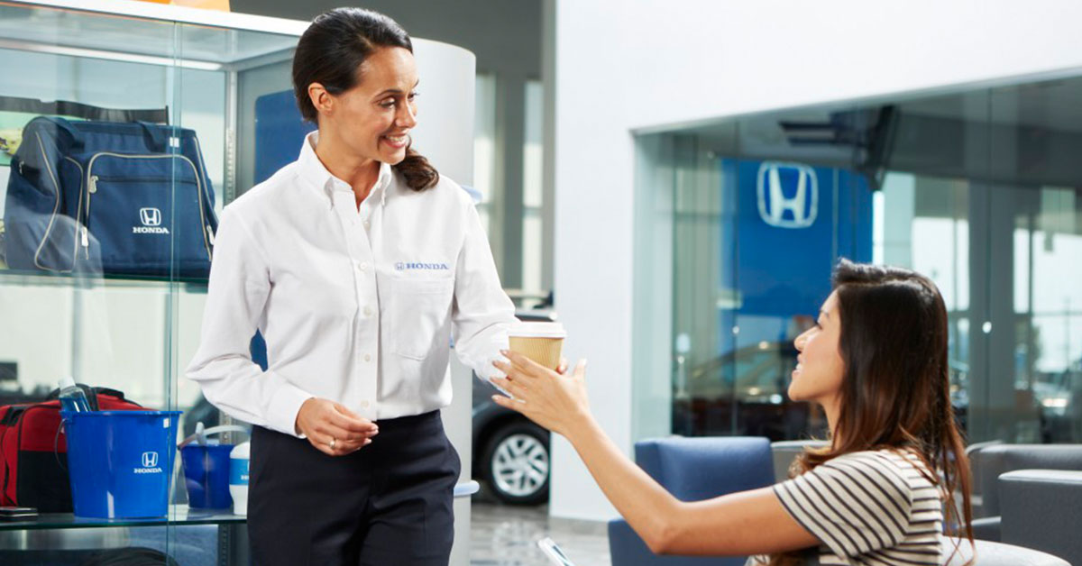 Customer speaking with a salesperson at a Honda dealership