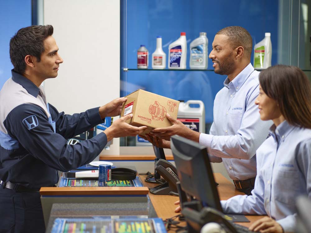 Honda service technician taking genuine Honda parts