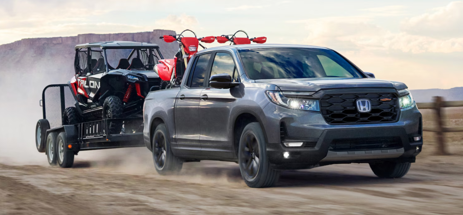 2026 Honda Ridgeline TrailSport towing off-road vehicle and dirt bikes